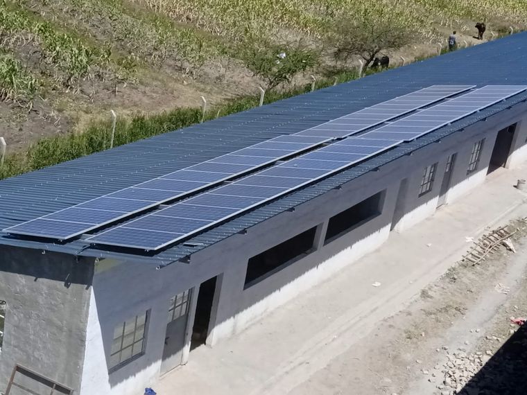 A grid-tied rooftop solar array installed on an institutional building
