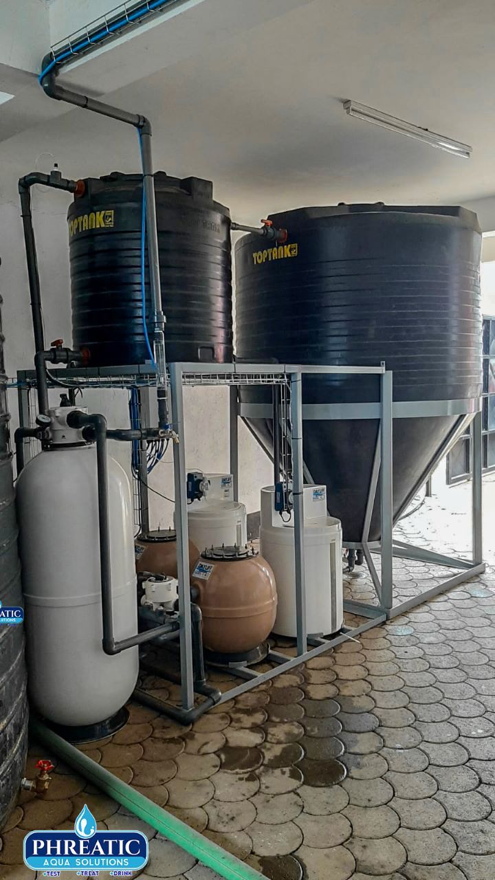 A water treatment plant with filtration vessels and storage tanks installed by Phreatic
